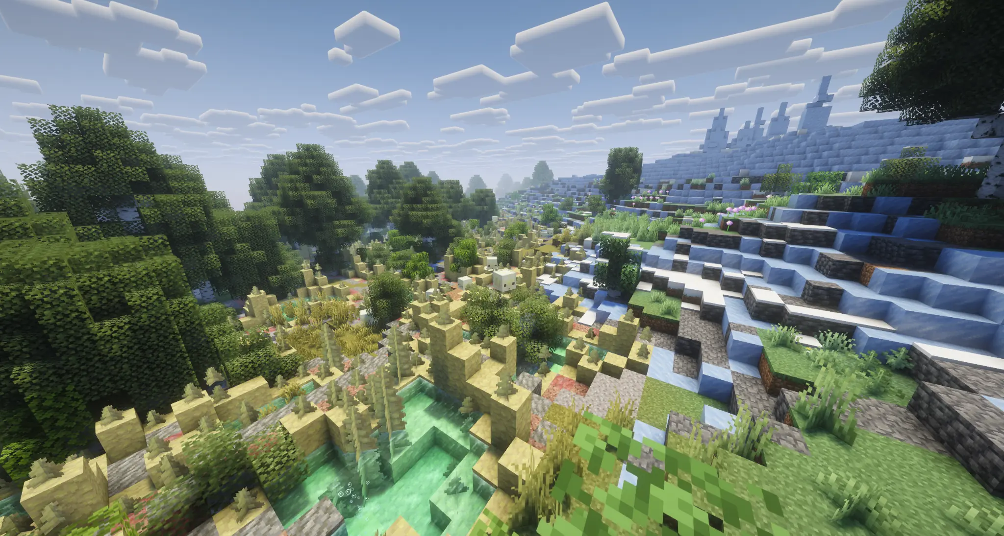 Green valley meeting a frozen mountain biome