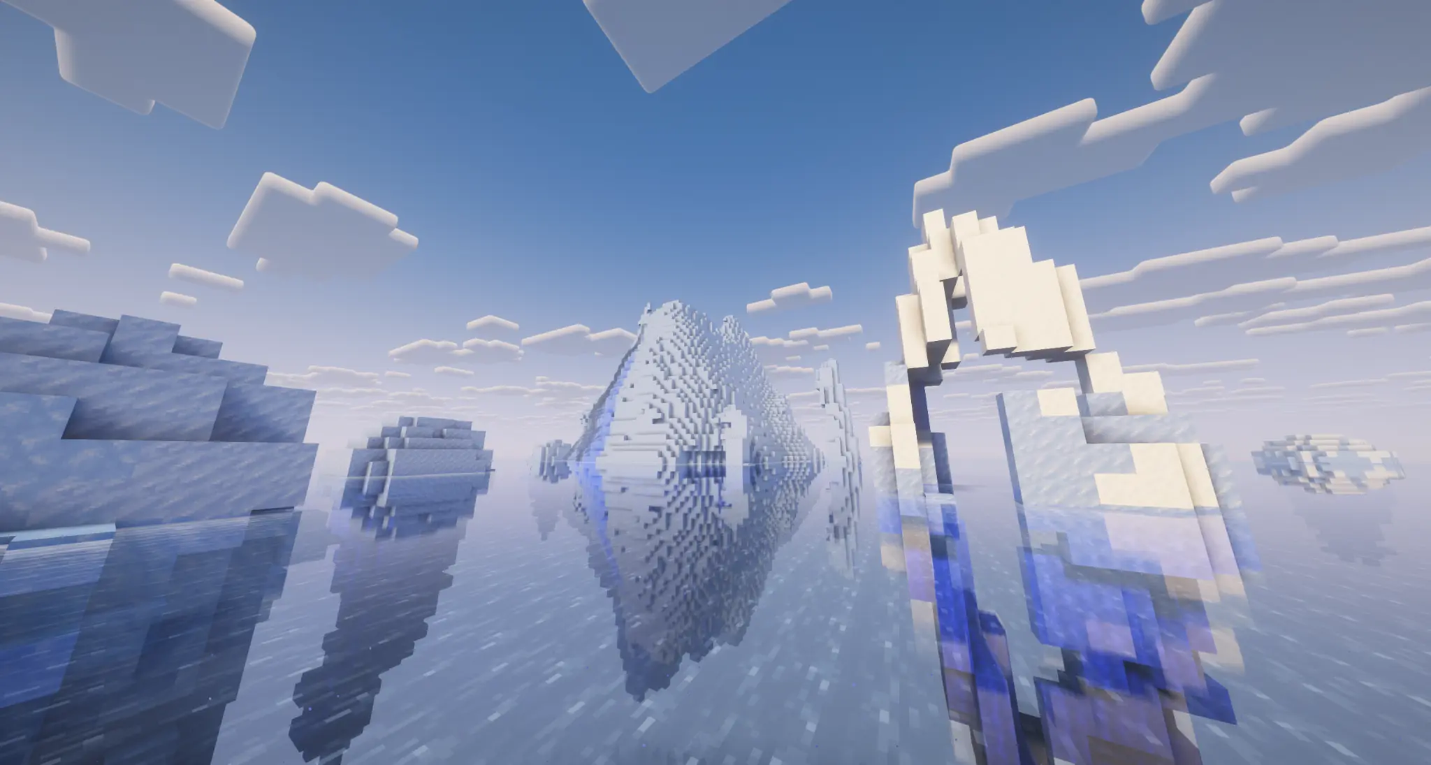Icebergs rising from a reflective frozen ocean